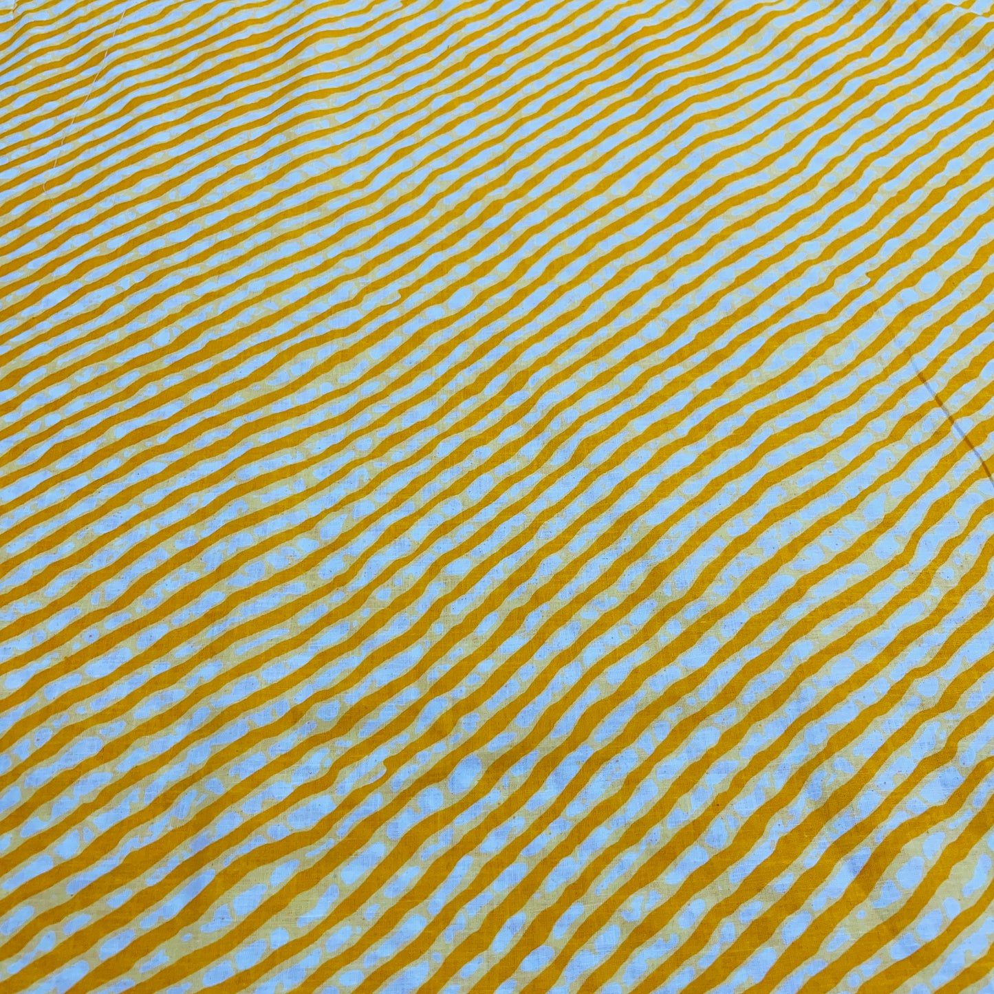 White & Yellow Lehriya Print Cotton Fabric - TradeUNO