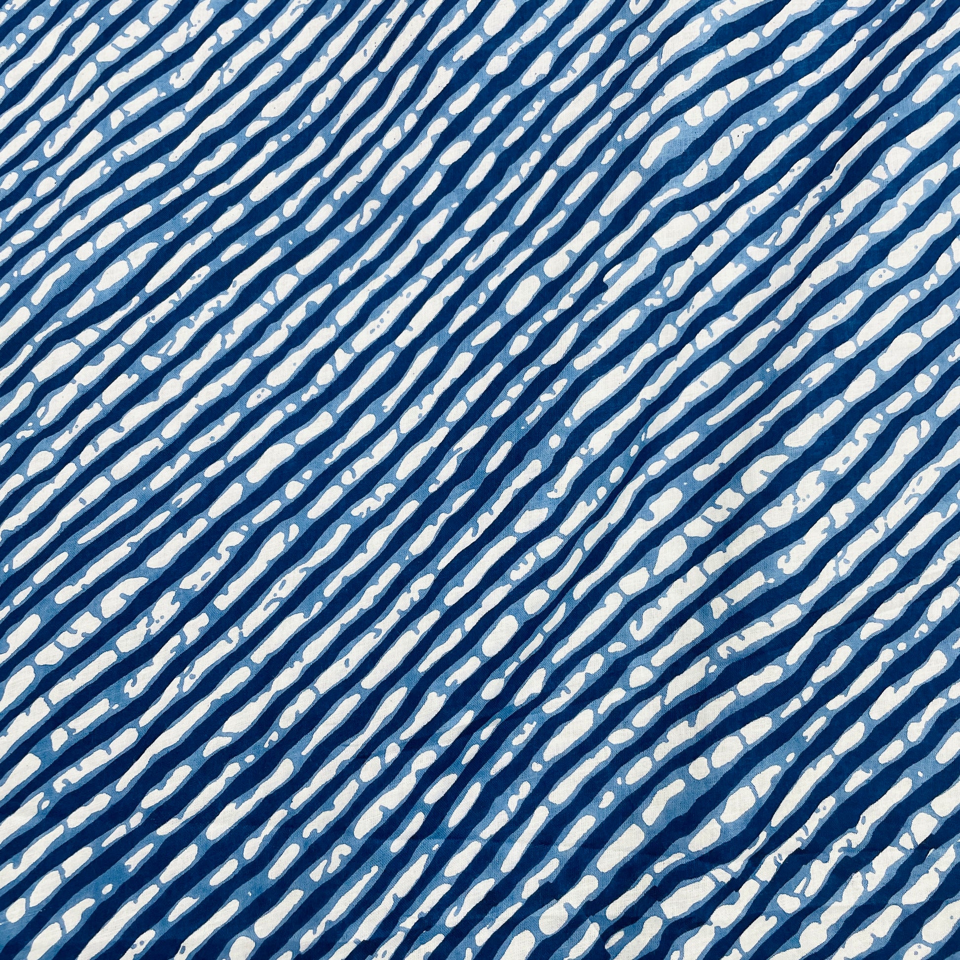 White & Blue Lehriya Print Cotton Fabric - TradeUNO