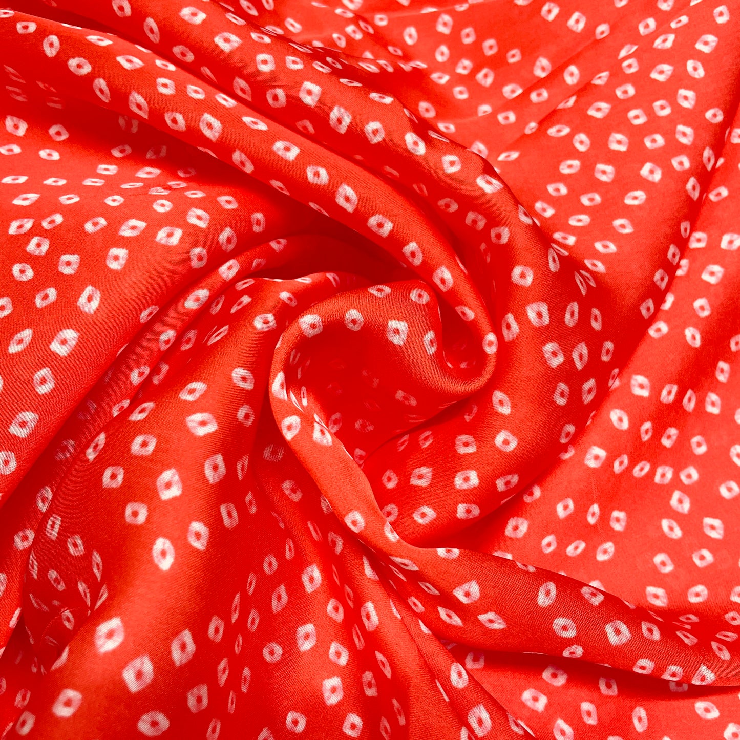 Red Bandhani Print Georgette Satin Fabric - TradeUNO