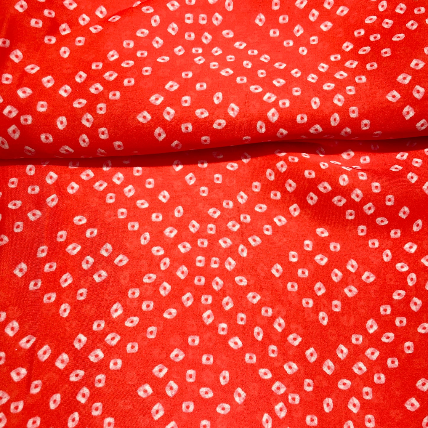 Red Bandhani Print Georgette Satin Fabric - TradeUNO