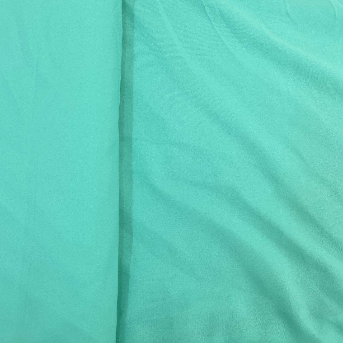 Exclusive Mint Green Solid Malai Crepe Fabric