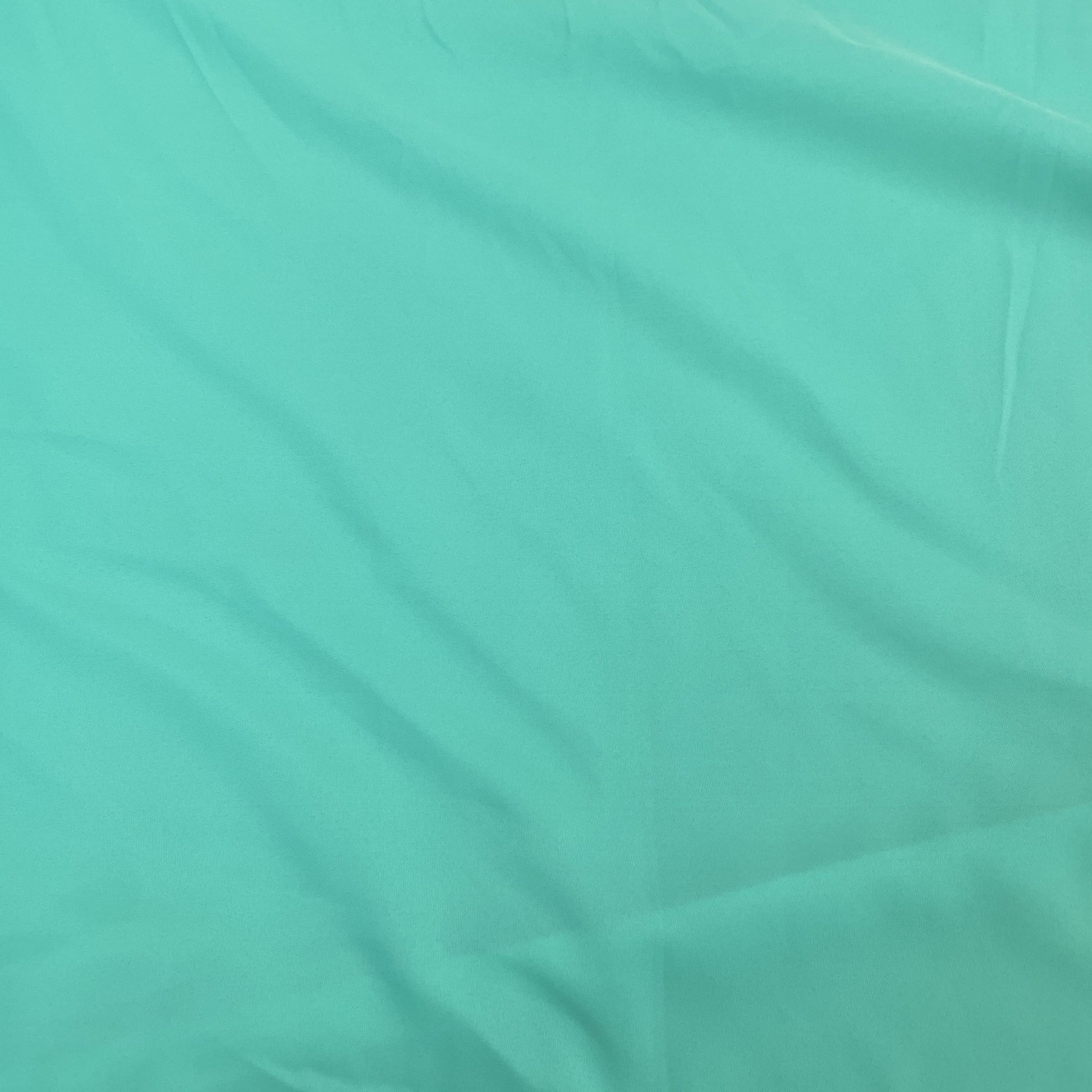 Exclusive Mint Green Solid Malai Crepe Fabric