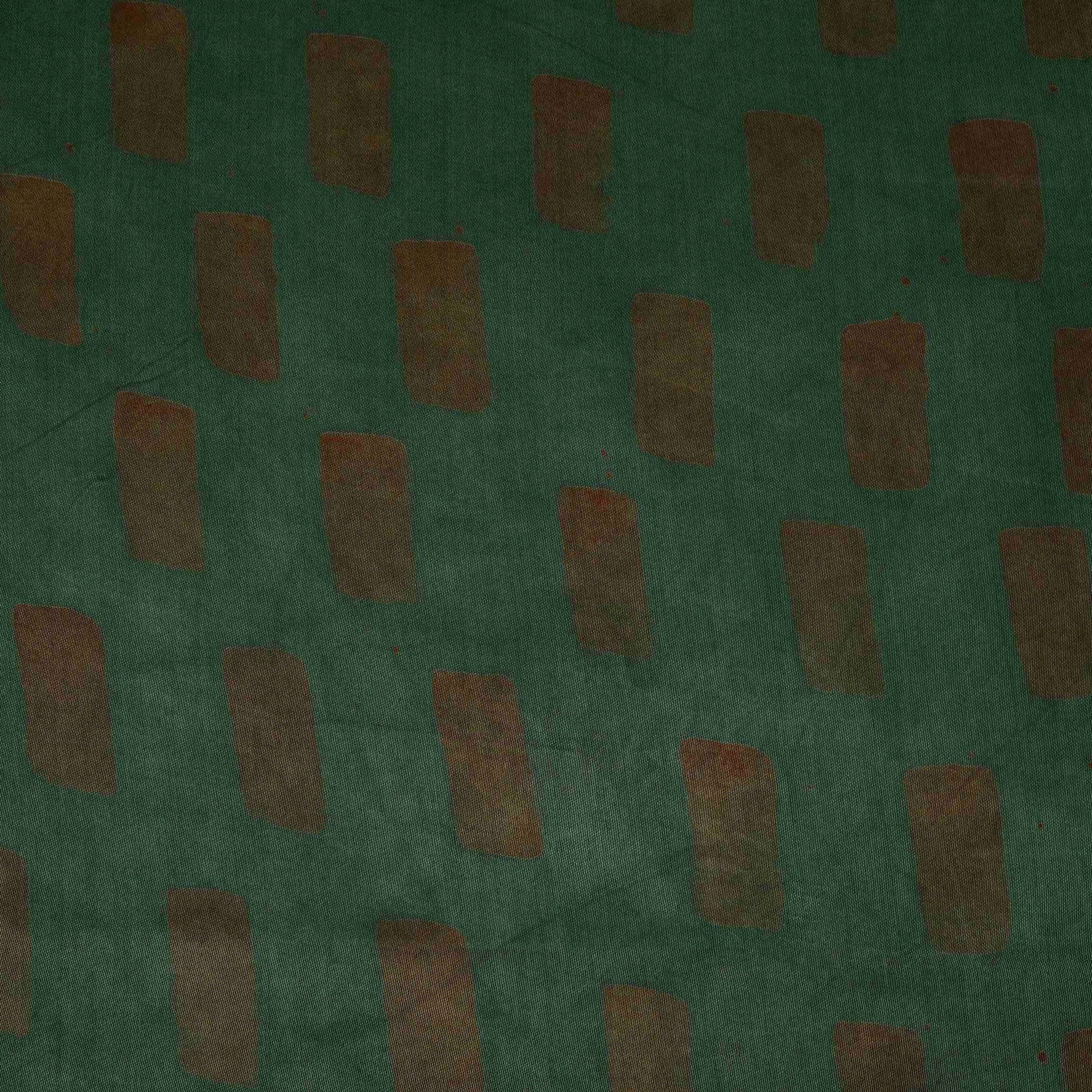Dark green handblock batik print light modal satin fabric with a smooth, lustrous sheen, ideal for ethnic wear.
