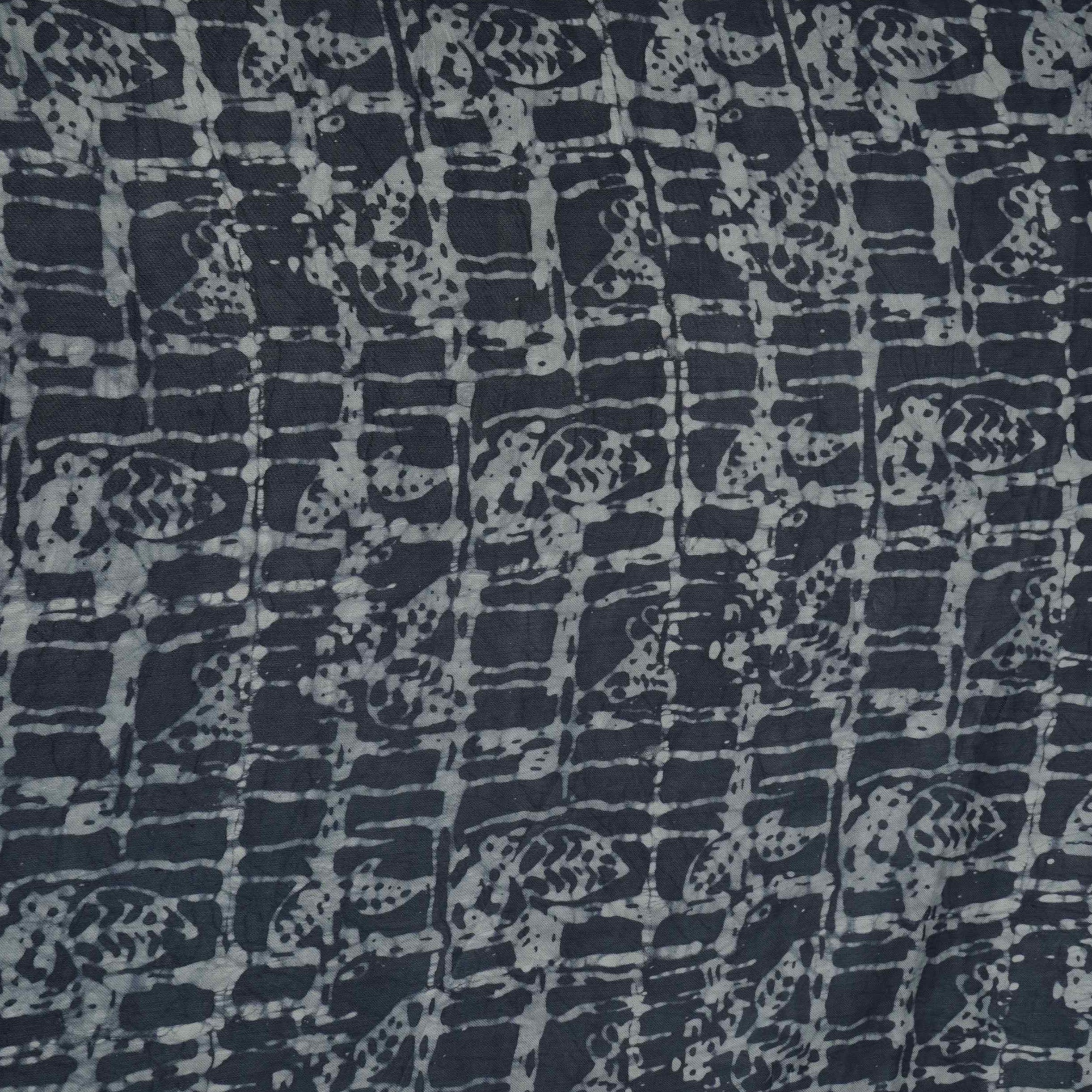 Indigo blue batik print light modal satin fabric with a smooth, lustrous sheen, ideal for ethnic wear.