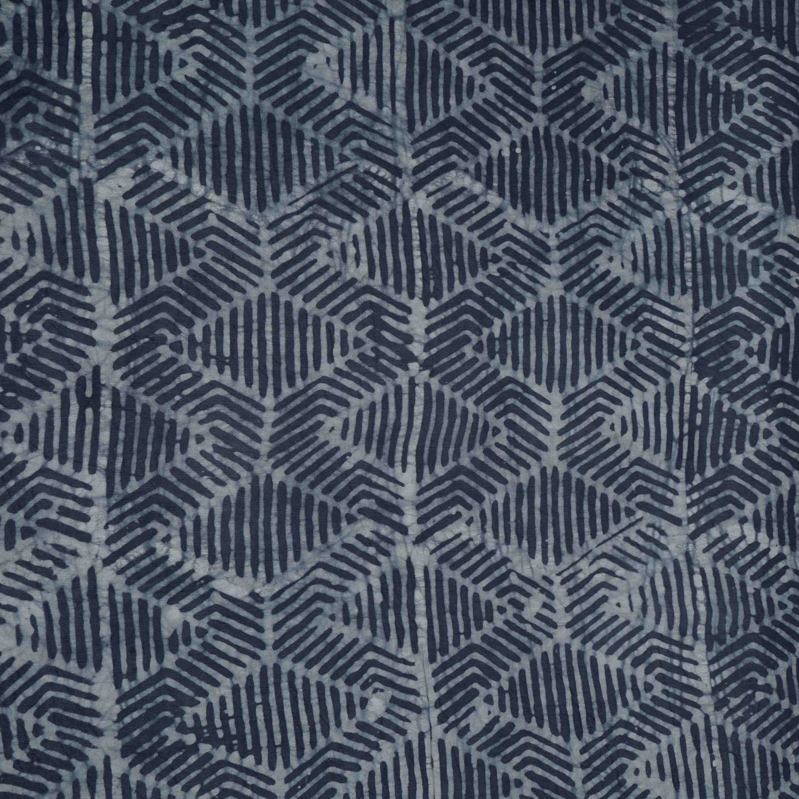 Indigo blue abstract batik print light modal satin fabric with a smooth, lustrous sheen, ideal for ethnic wear.
