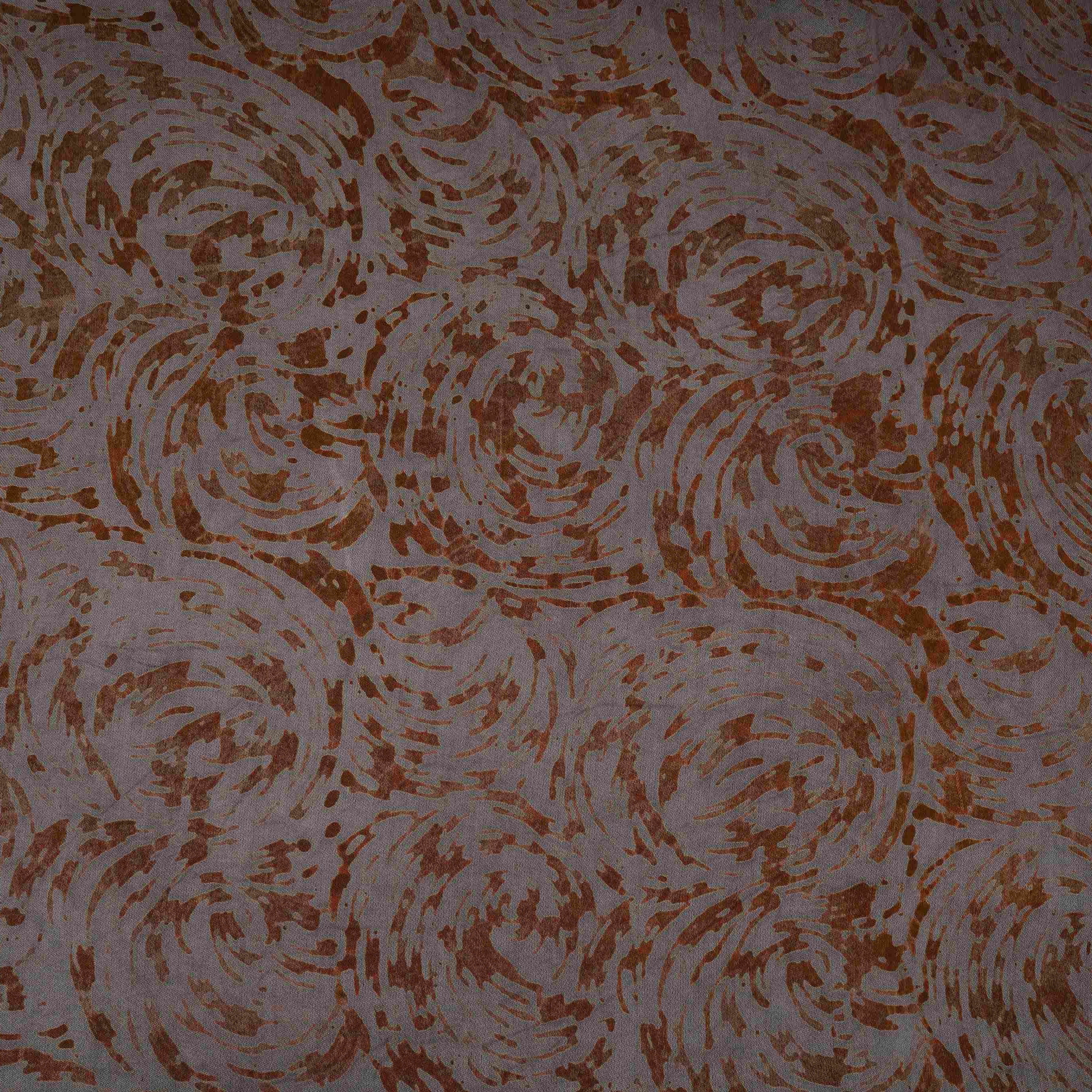 Grey batik print light modal satin fabric with a smooth, lustrous sheen, ideal for ethnic wear.