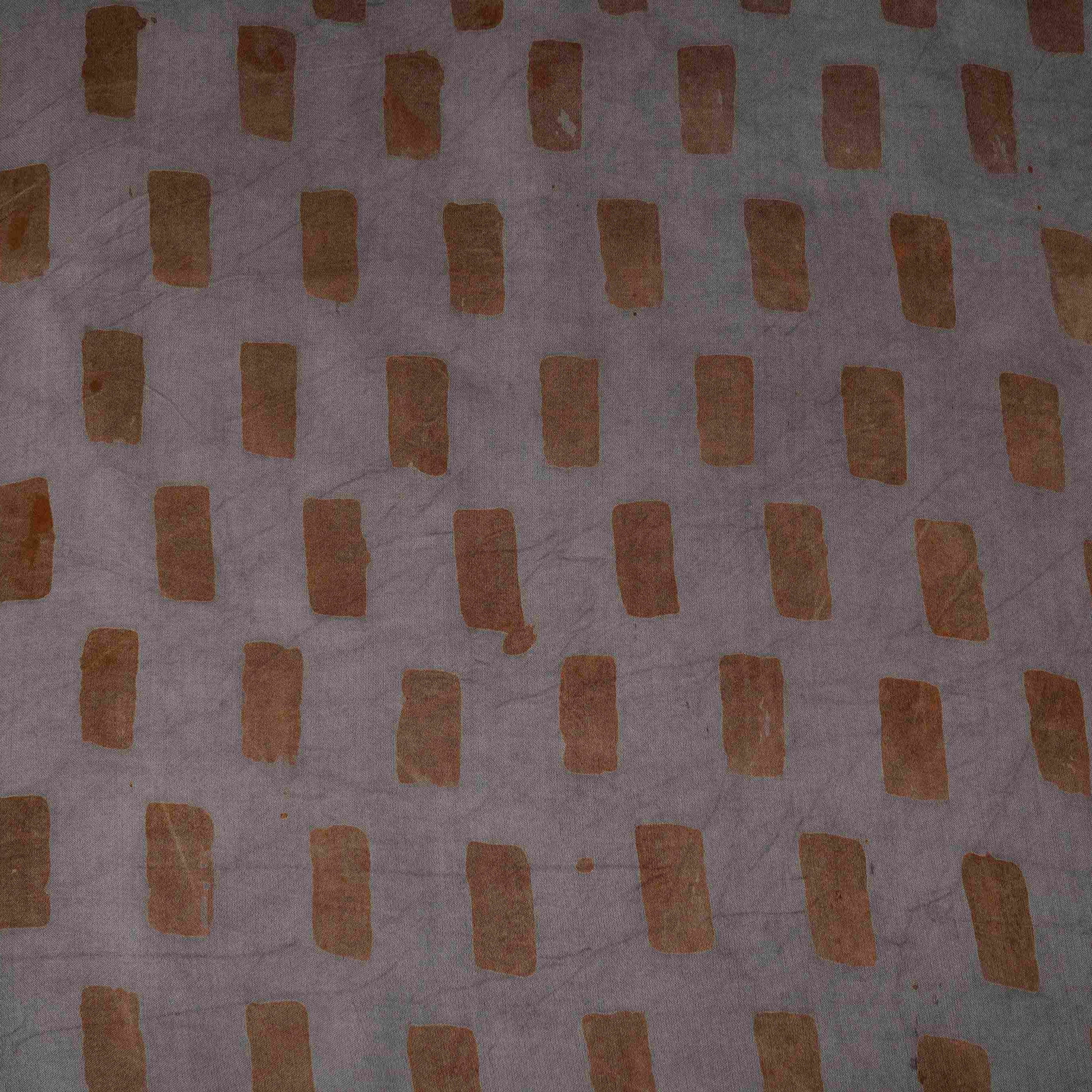 Grey block batik print light modal satin fabric with a smooth, lustrous sheen, ideal for ethnic wear.