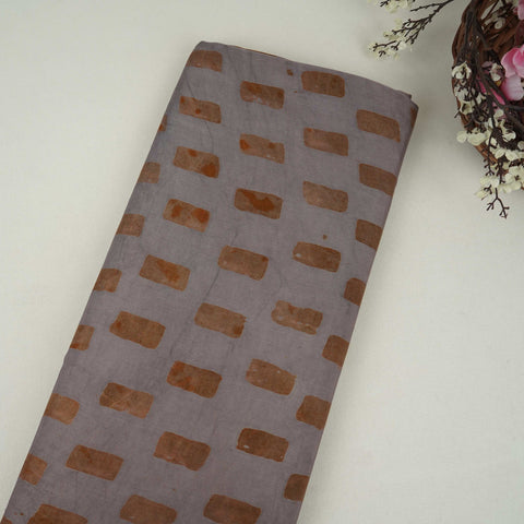 Grey block batik print light modal satin fabric with a smooth, lustrous sheen, ideal for ethnic wear.