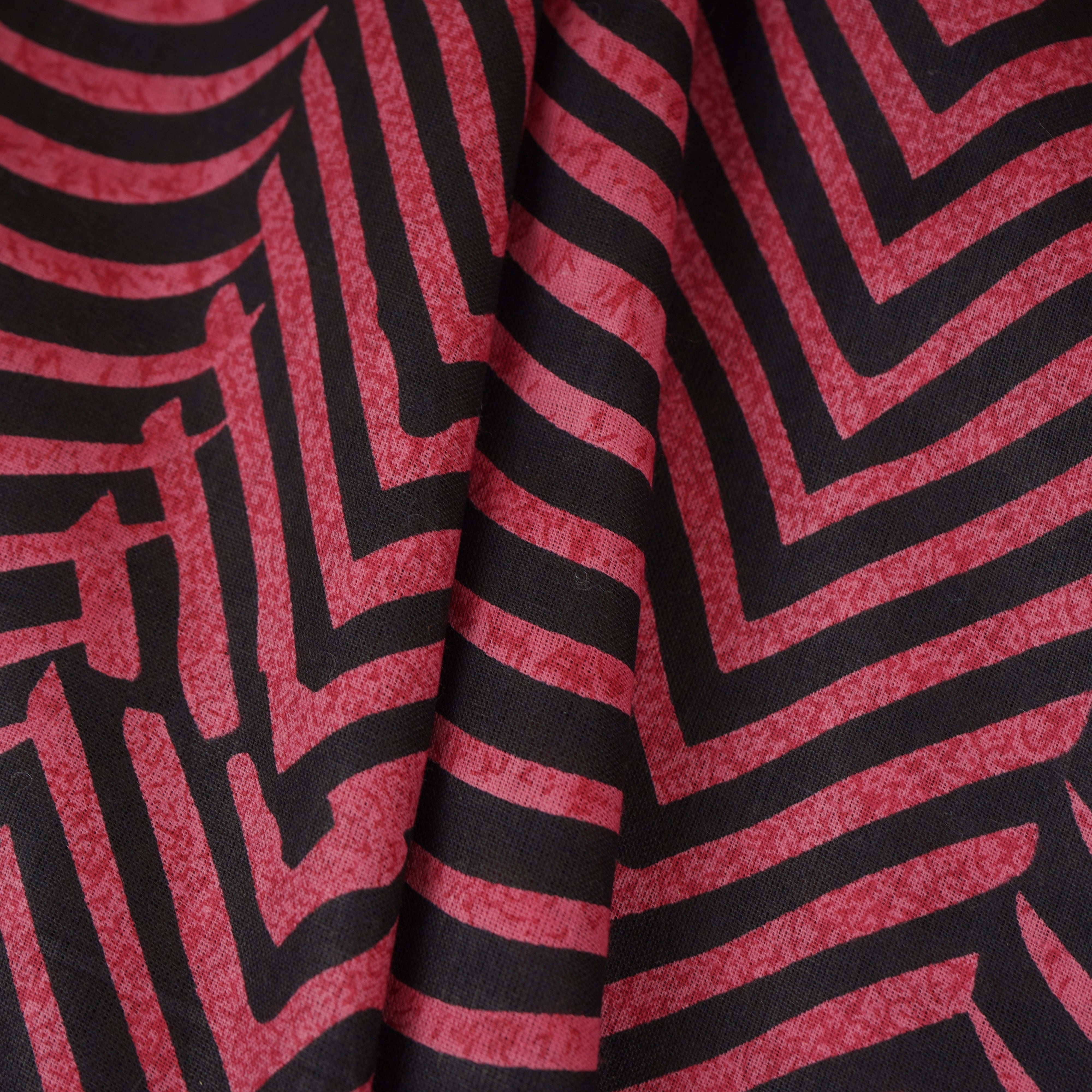 Pink & Black Abstract Print Cotton Fabric MFR-29850 - TradeUNO