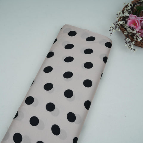 Cream and black polka dot modal satin fabric for festive wear