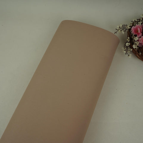 Beige banana crepe fabric with a soft flowy drape for western wear
