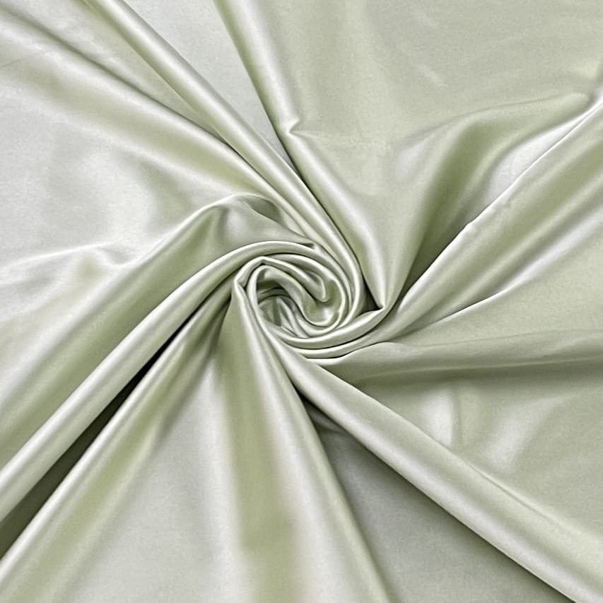 premium pista green solid celina satin with lycra fabric