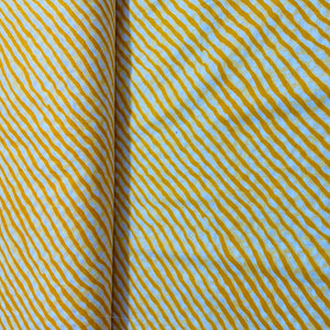 White & Yellow Lehriya Print Cotton Fabric - TradeUNO