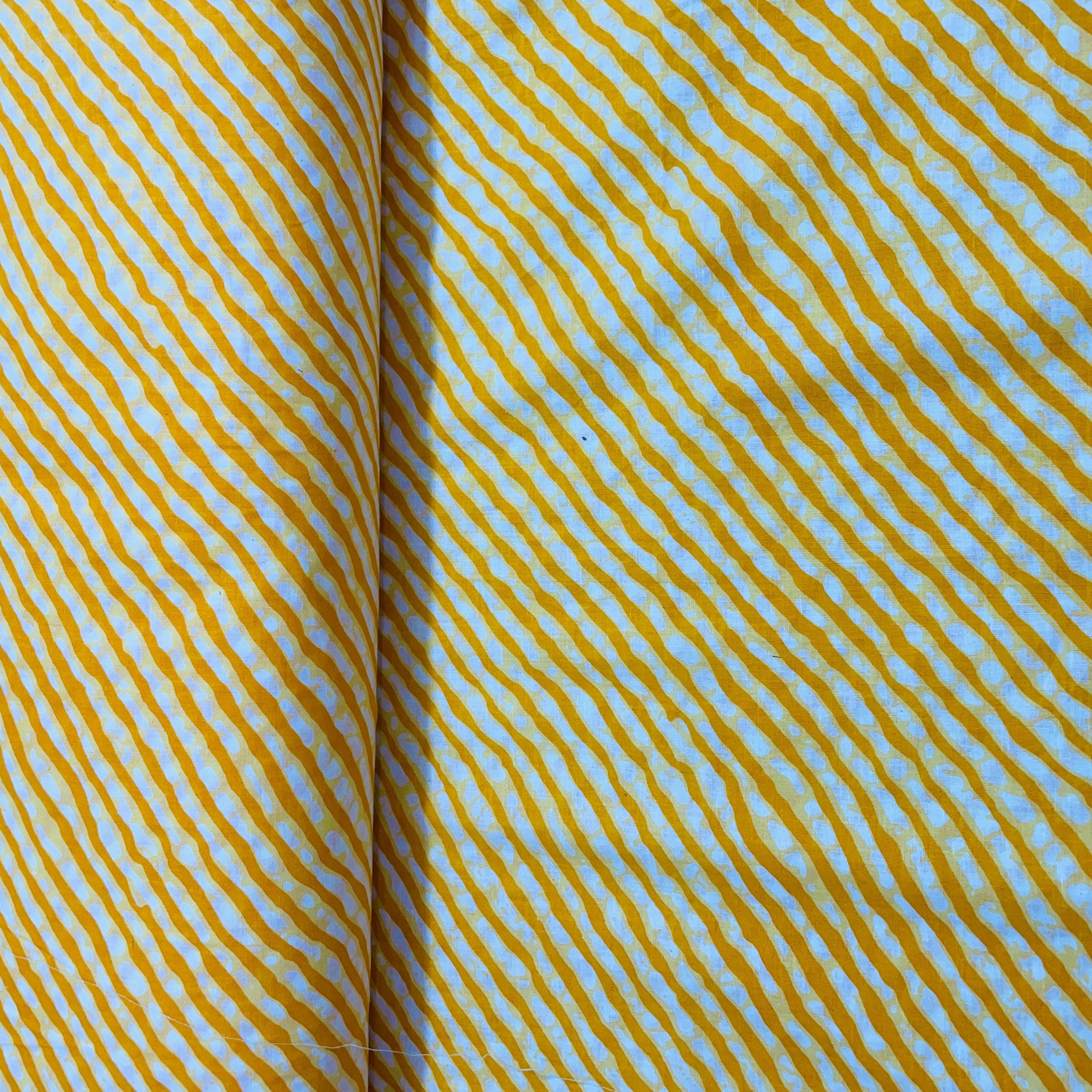 White & Yellow Lehriya Print Cotton Fabric - TradeUNO