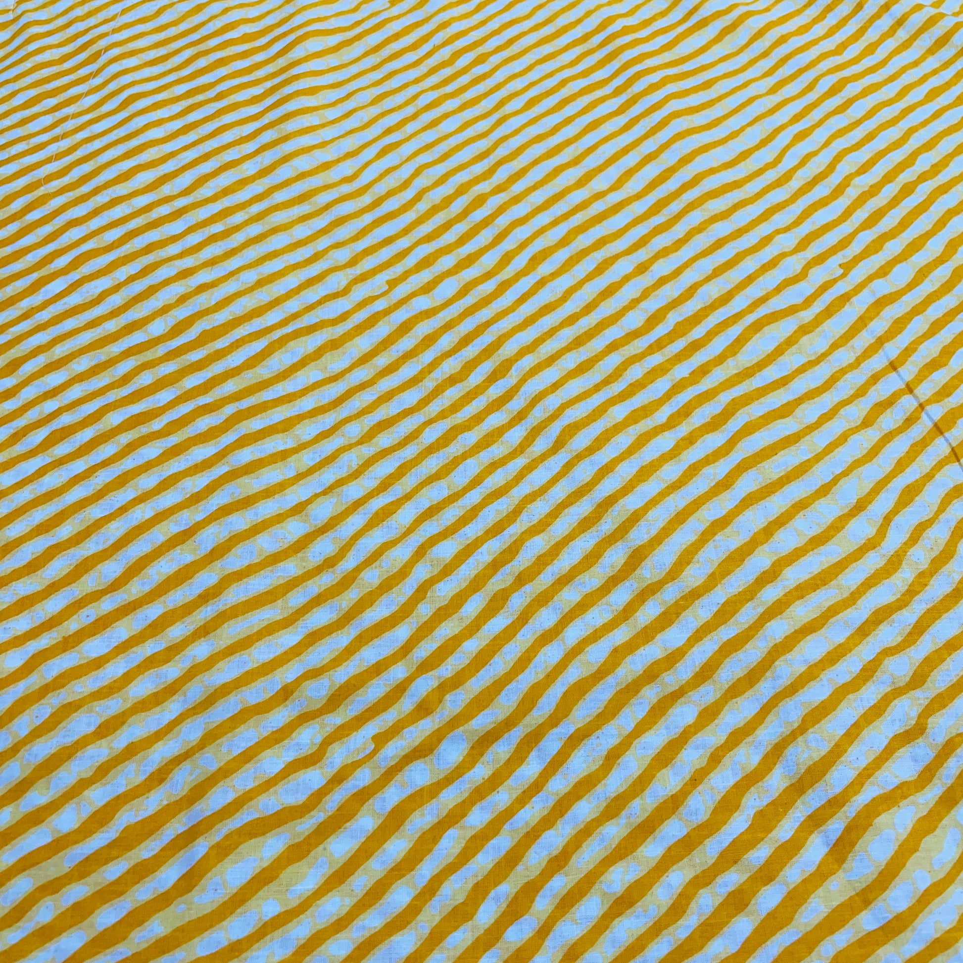 White & Yellow Lehriya Print Cotton Fabric - TradeUNO