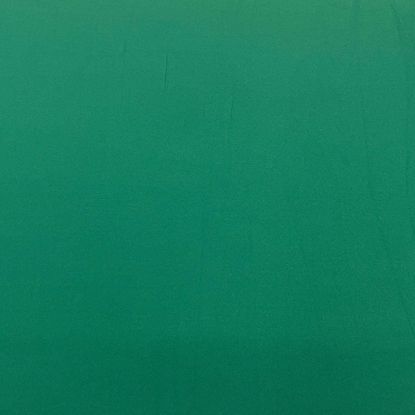 Exclusive Pine Green Solid Malai Crepe Fabric