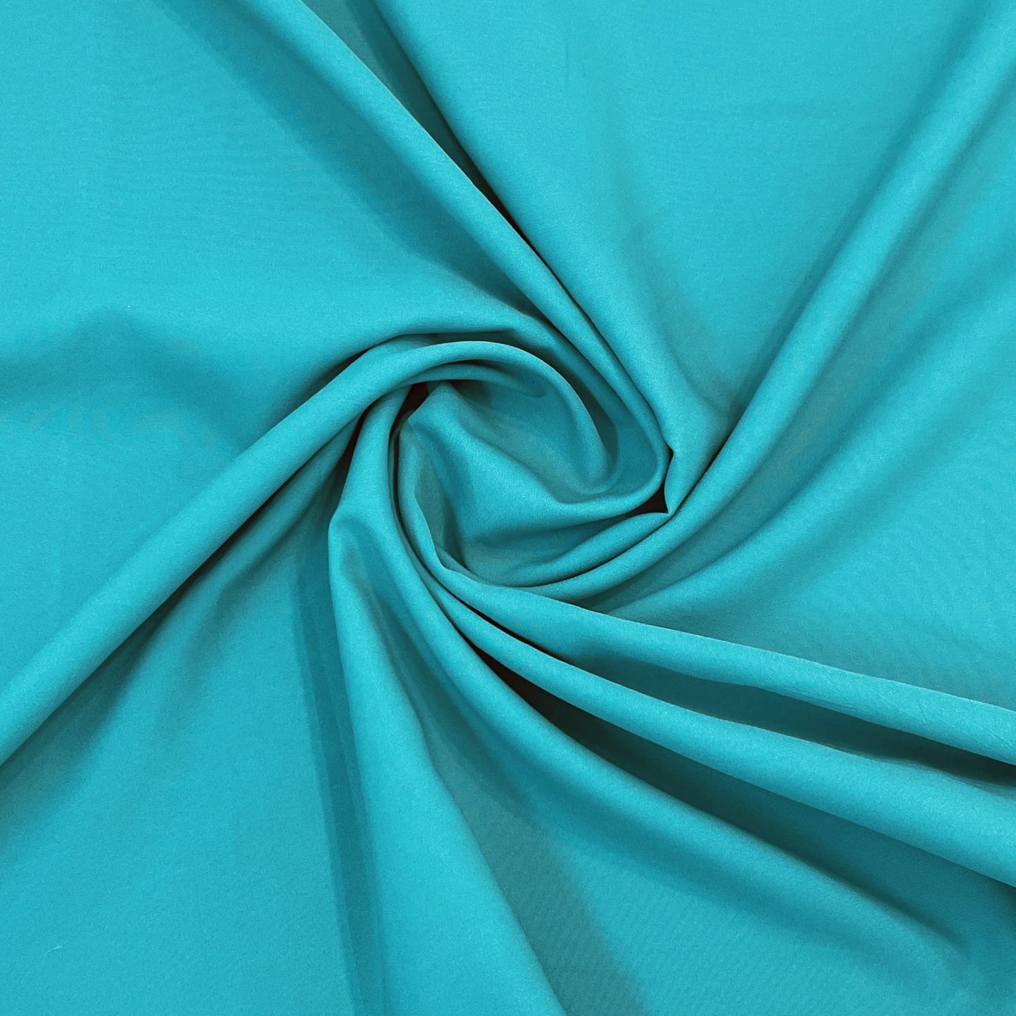 Exclusive Turquoise Green Solid Malai Crepe Fabric