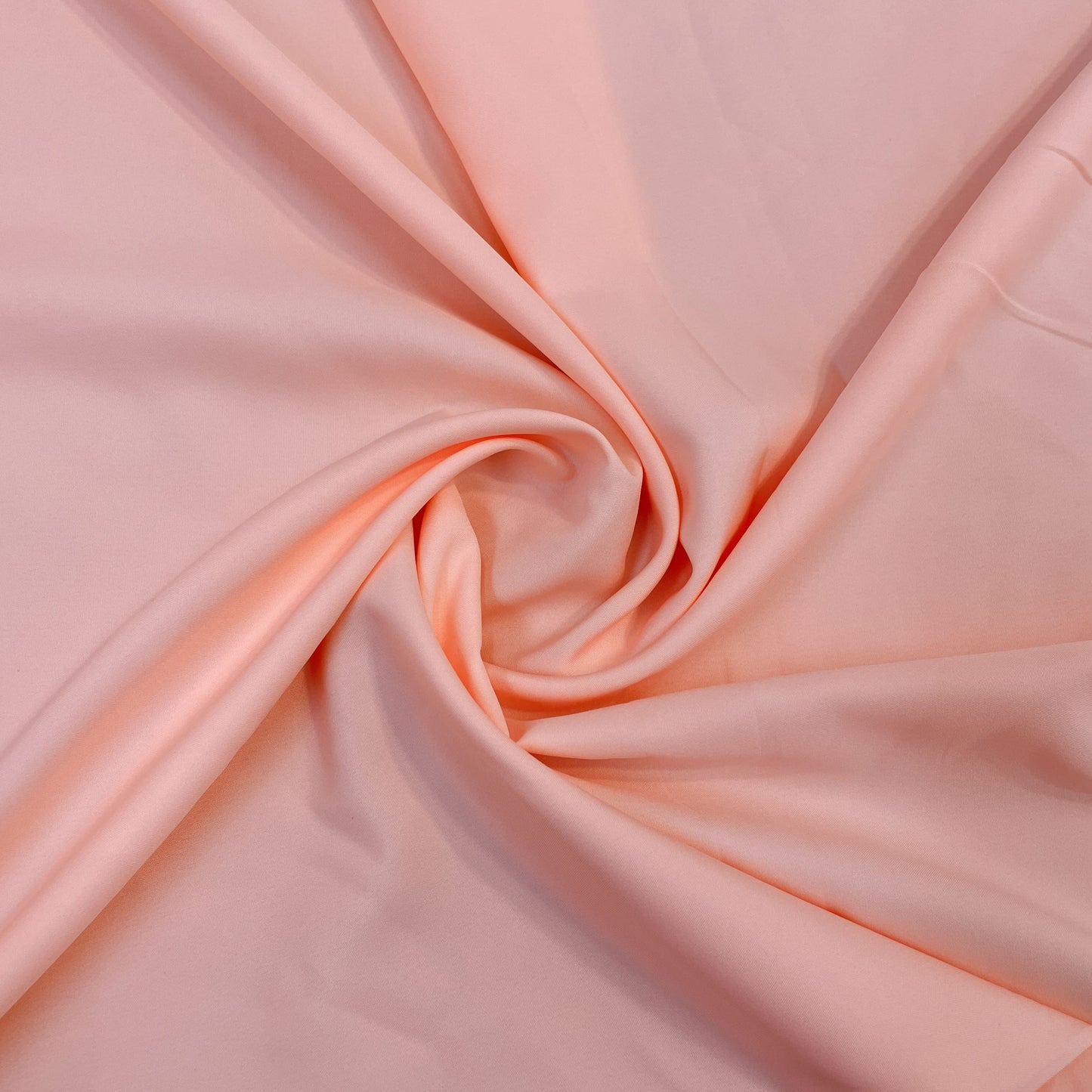 Exclusive Peach Pink Solid Malai Crepe Fabric