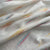 Premium OffWhite Orange Multicolor Ikkat Dobby Embroidery Dyeable Cotton Fabric