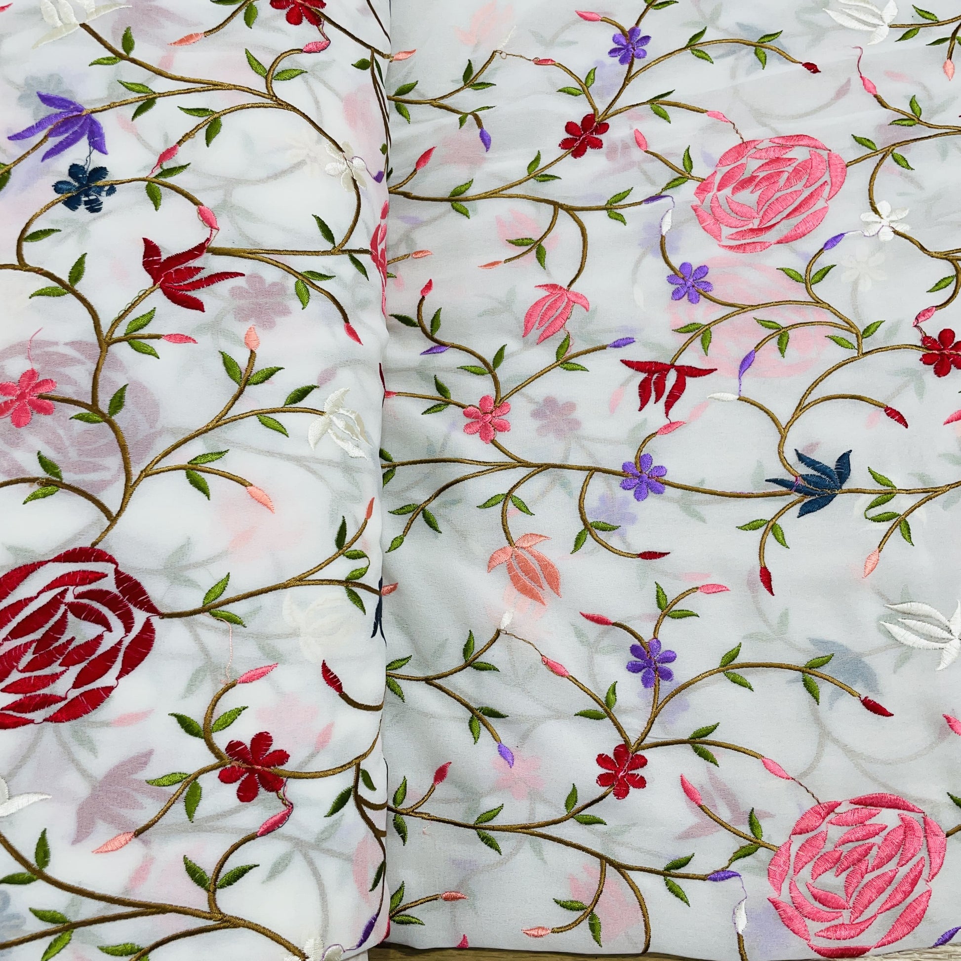 White & Multicolor Floral Embroidery Georgette Fabric - TradeUNO