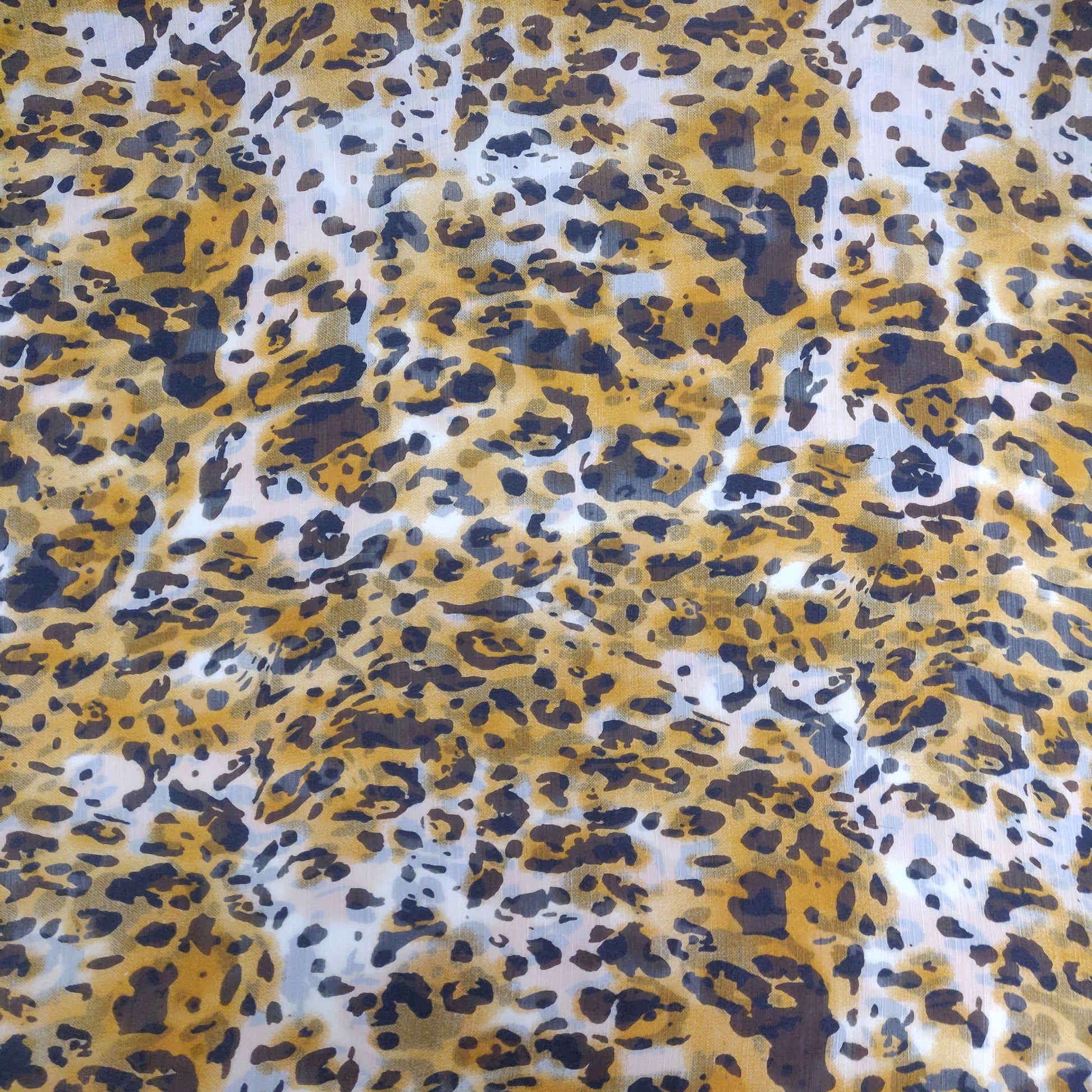 White With Yellow Animal Print Chiffon Fabric - TradeUNO