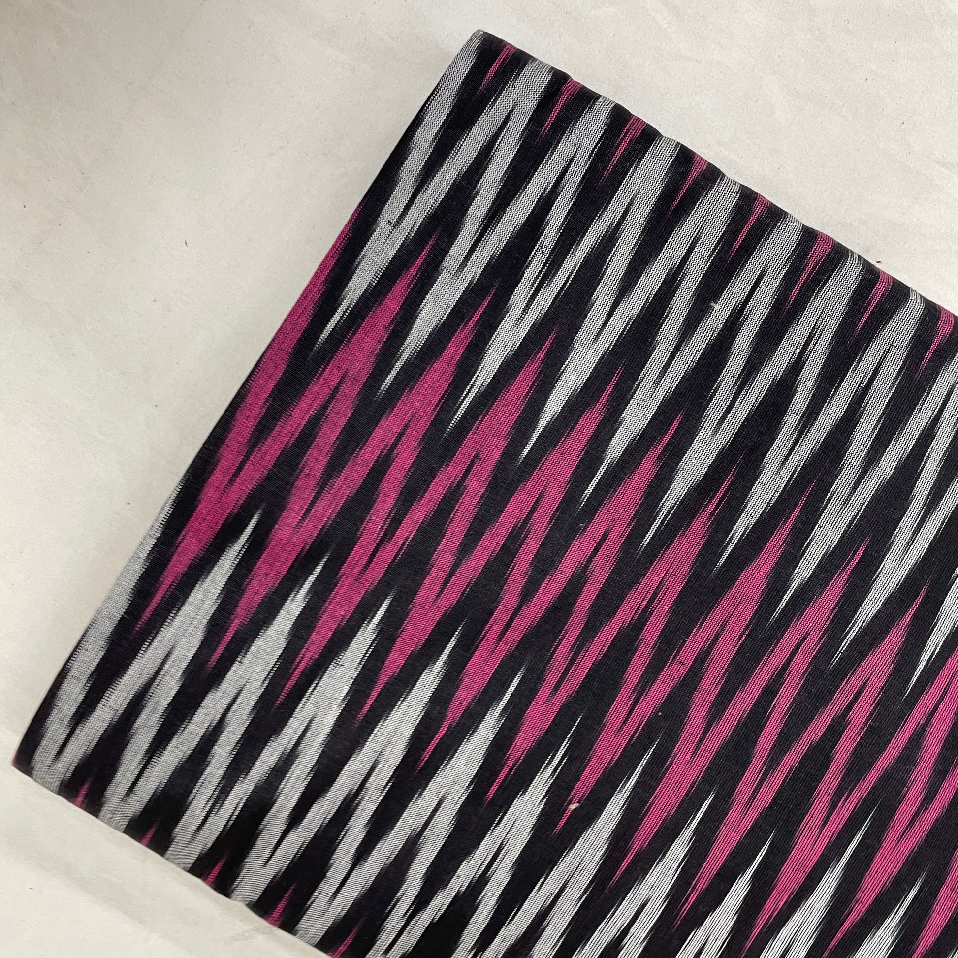 Grey With Pink Ikkat Print Cotton Fabric - TradeUNO